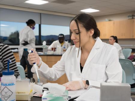 ACC Medical Laboratory Technology (MLT) student working in classroom at the Littleton Campus.