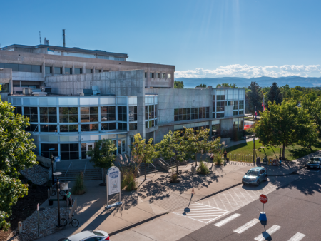 ACC Littleton Campus main building with Rocky Mountains in the background