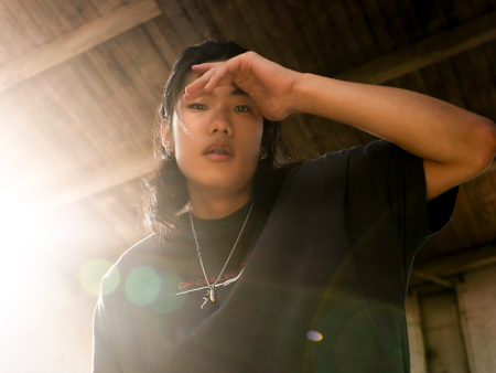 Photo of a woman with sunlight behind her by Dusty Bookhamer