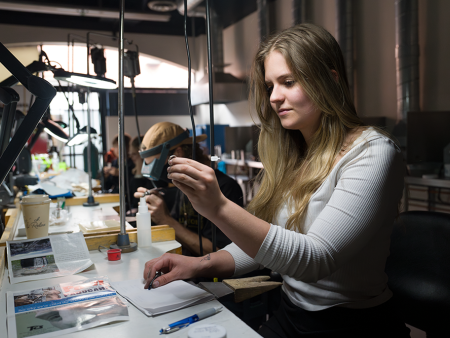 ACC student making metal jewelry at the Art & Design Center at the Littleton Campus.