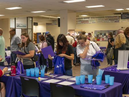 ACC students visiting resource tables at the Littleton Campus Welcome Back BBQ.