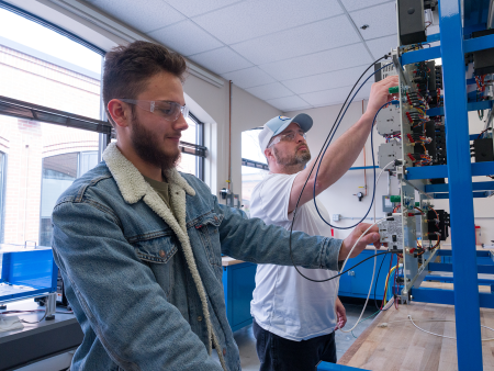 ACC students working in the robotics / building controls lab at the DCSD Legacy Campus