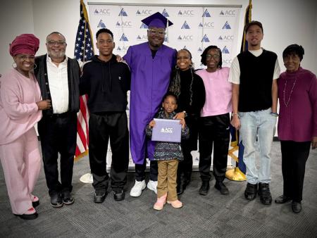 ACC Alum Ayanda Dladla-Ndlovu with his family in the Half Moon at ACC's Littleton Campus.