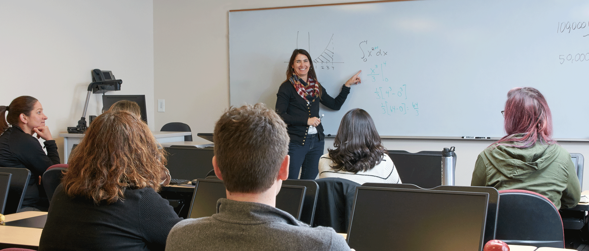 ACC Math faculty teaching students in classroom at ACC Littleton Campus.