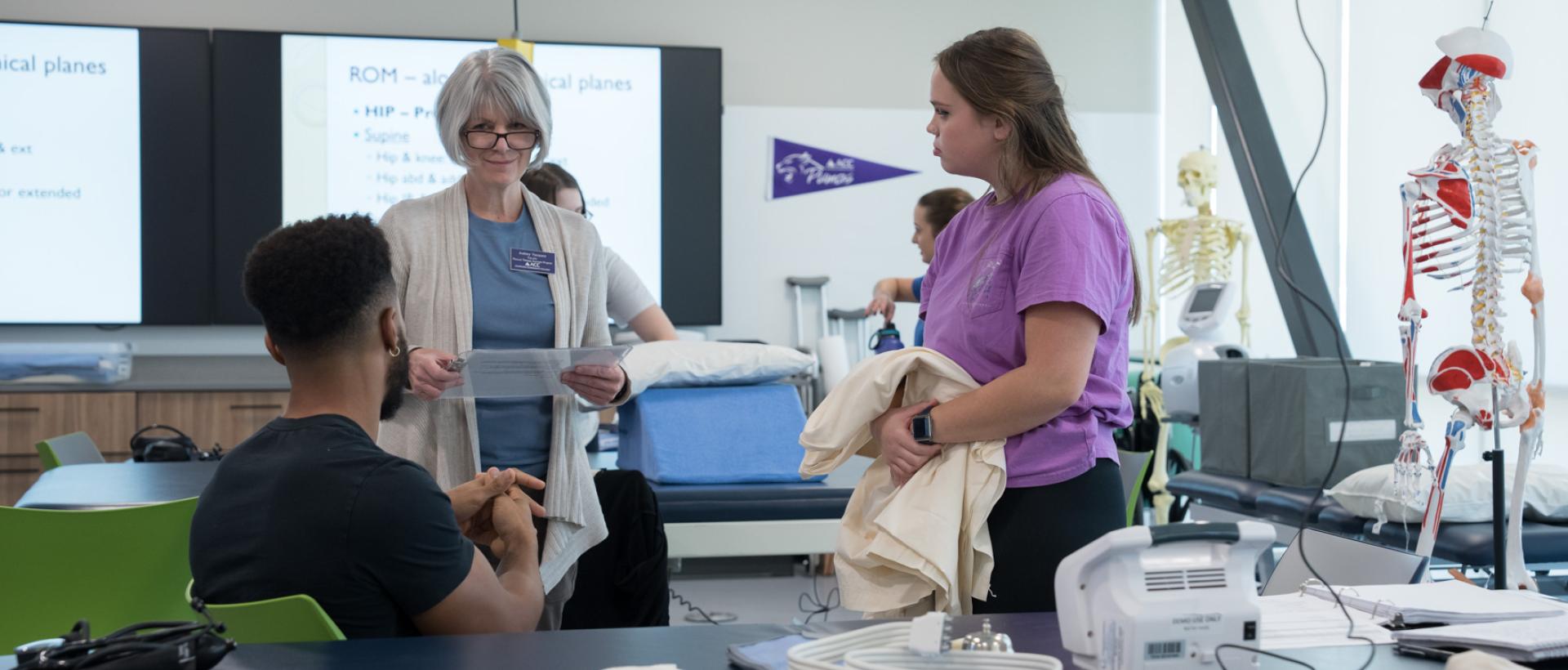 Faculty member and students in Physical Therapy Assistant class at ACC's Sturm Collaboration Campus at Castle Rock.