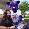 ACC student at computer with ACC Puma helping