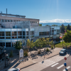 ACC Littleton Campus main building with Rocky Mountains in the background