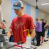 ACC student, Ian Williams, in Robotics and Automation Technology classroom at DCSD Legacy Campus in Lone Tree.