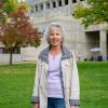 Littleton resident and Littleton Rotary Club member Ms. Terry M. Terry on the west side of ACC's Main Building at the Littleton Campus.