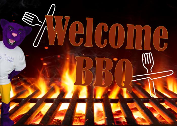 Welcome BBQ - Summit the ACC Puma next to grill with flames coming out.