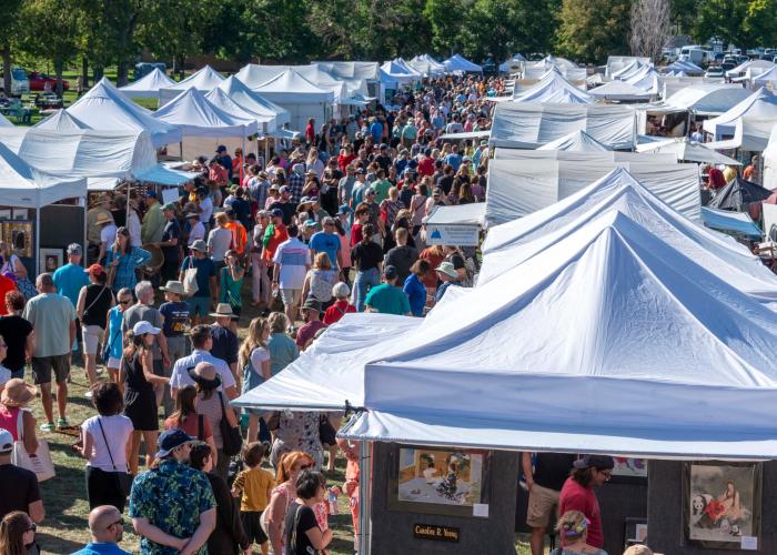 Affordable Arts Festival tents of artists and work and attendees at ACC's Littleton Campus.
