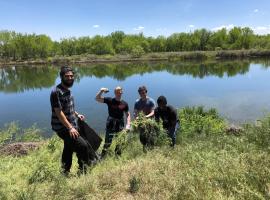 Communication Service Learning Assignment - Platte Park clean-up - pulling weeds