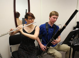 ACC Music students playing a flute and an oboe