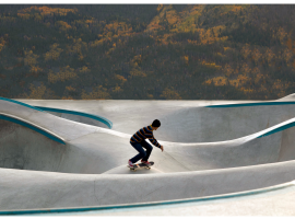 Person skateboarding at skate park (photo by Alexis Salminen)