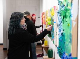 Community members exploring at through touch at the Colorado Gallery of the Arts at ACC