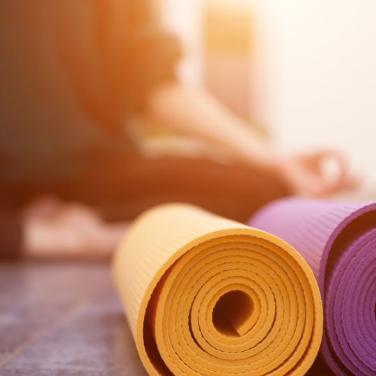 person with yoga mats