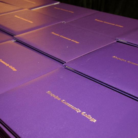 ACC diplomas on a table