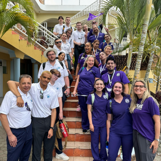 Group of ACC students and faculty members in the Dominican Republic - posing on staircase