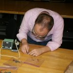 David Colclazier working on electronic components