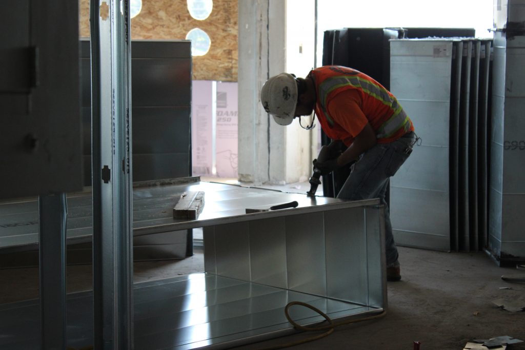 Construction worker drilling