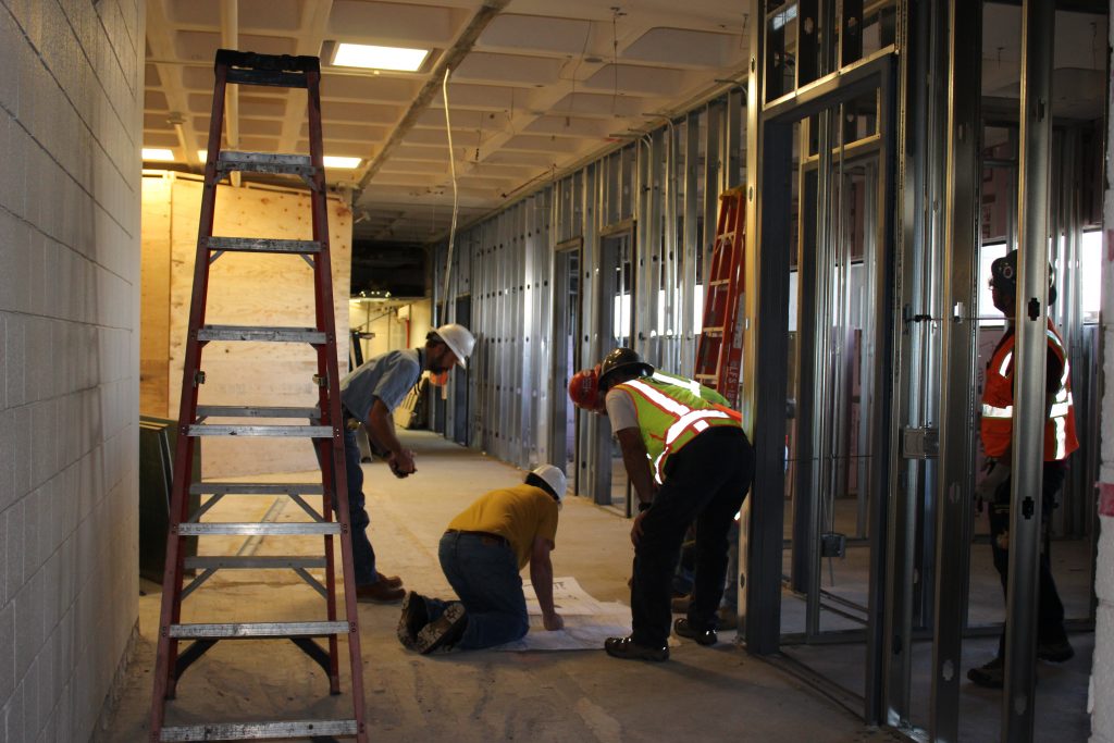 construction workers reviewing plans