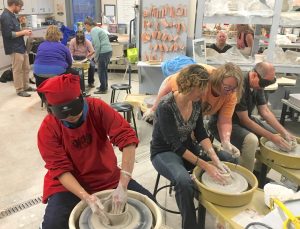 CCB students at potter's wheels at ACC